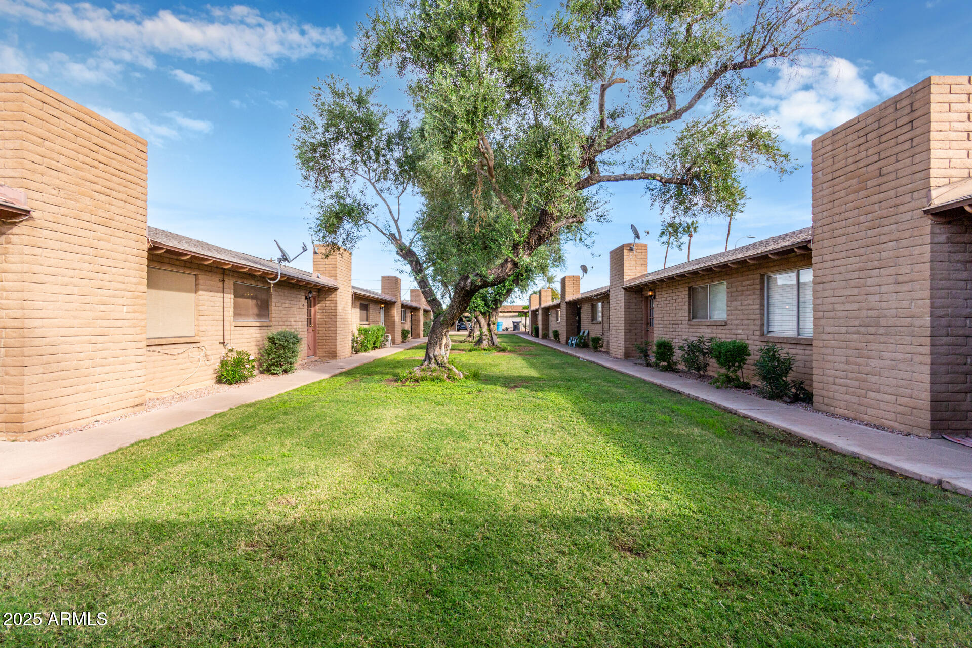 3031 South Rural Road, Unit 45 Tempe, AZ 85282 - Photo 24 of 28 a front view of house with yard and green space