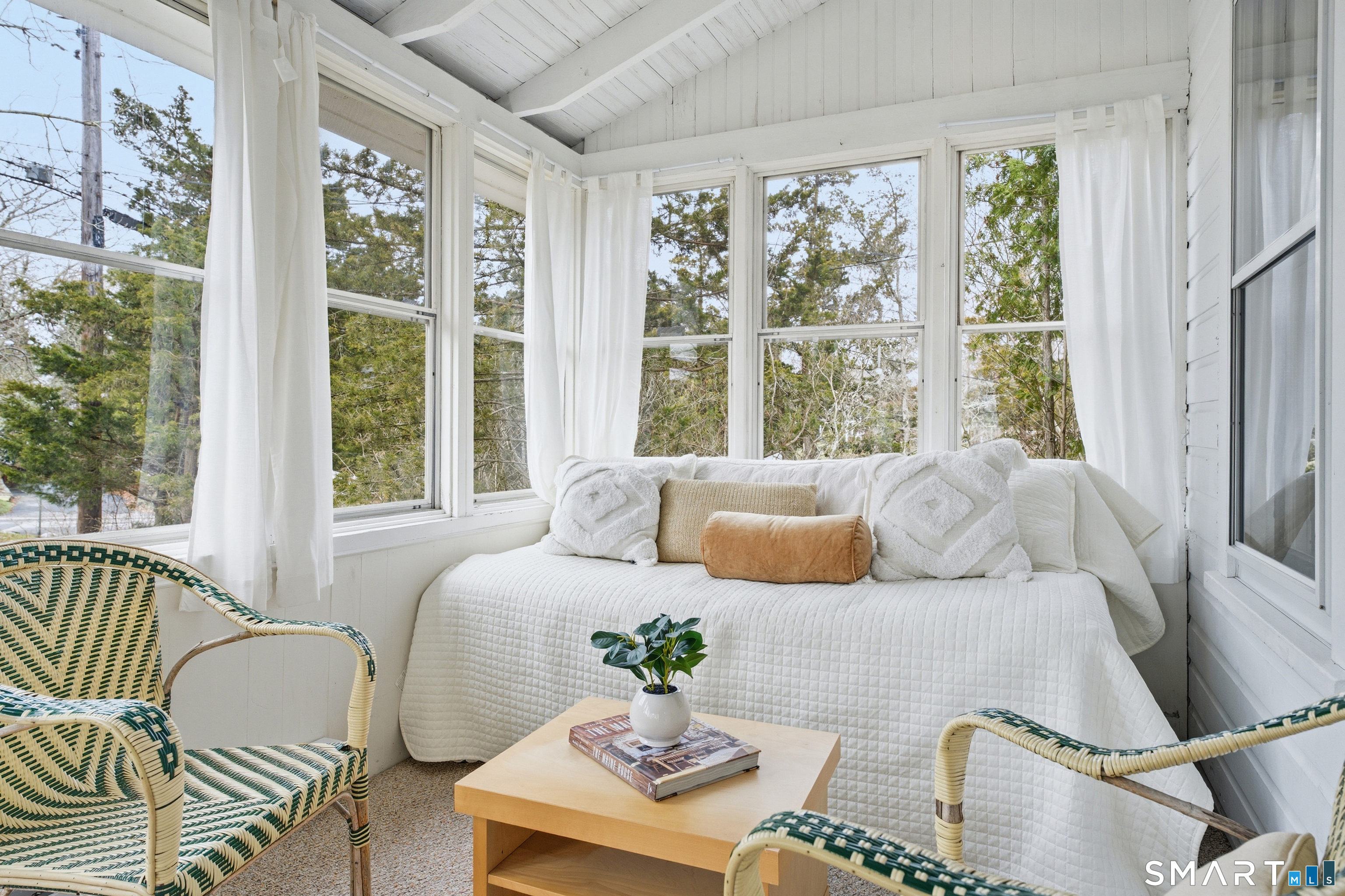 7 Pent Road Madison, CT 06443 - Photo 7 of 39 The sun room offers additional space to lounge, read, or visit with friends.