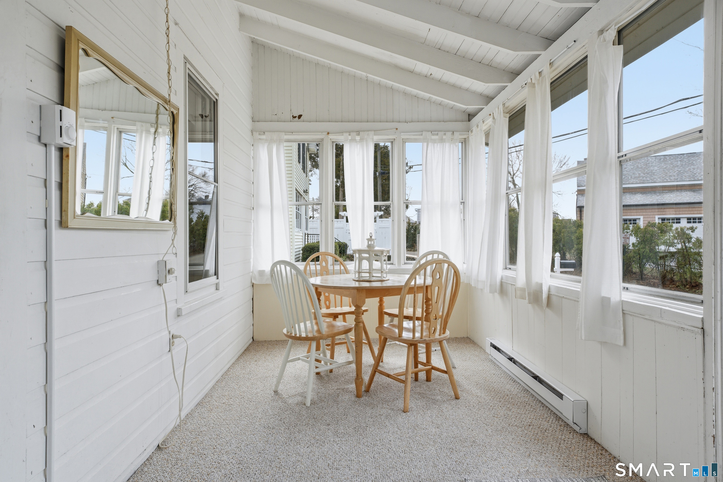 7 Pent Road Madison, CT 06443 - Photo 8 of 39 A sunny spot for morning coffee, games, or casual meals.