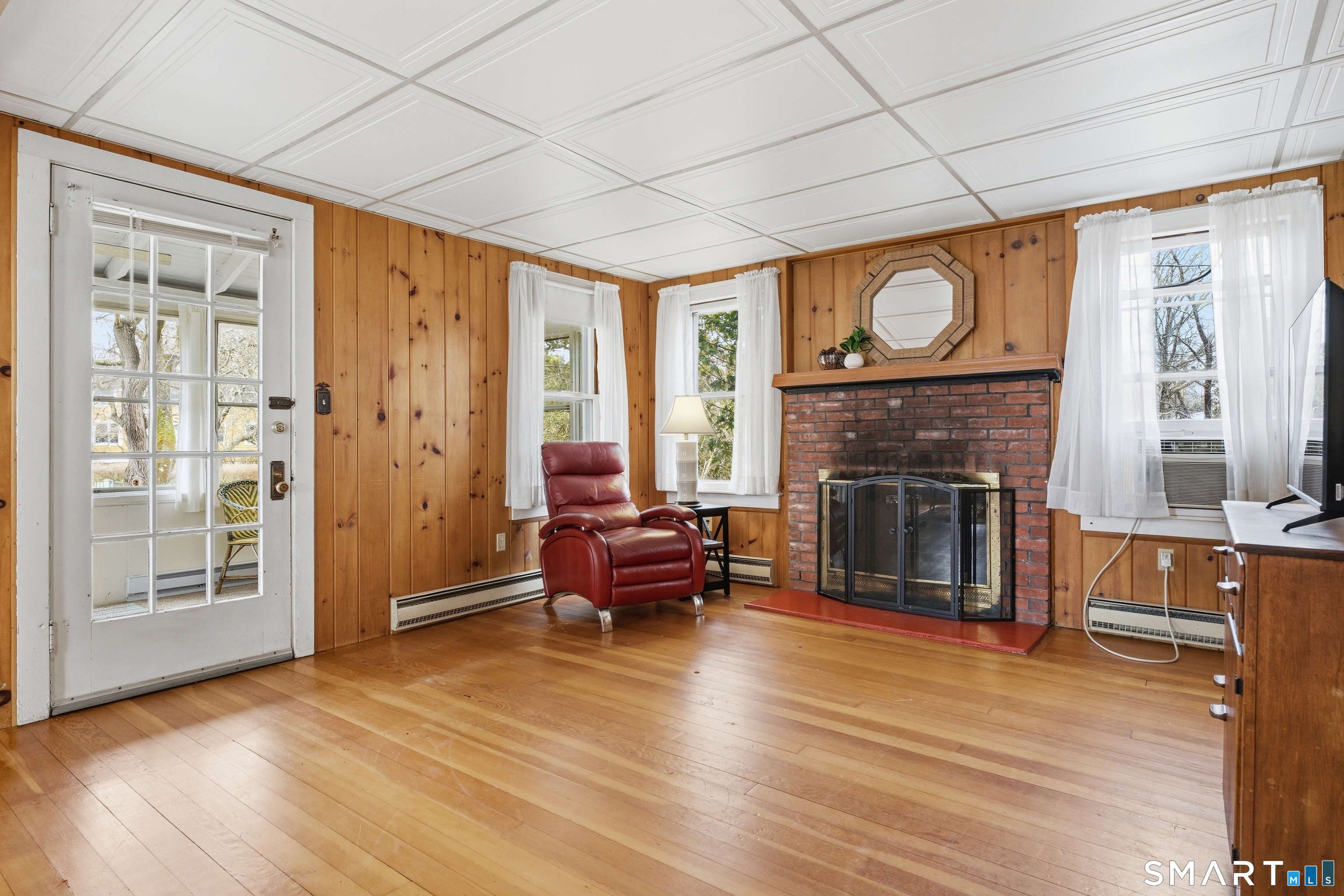7 Pent Road Madison, CT 06443 - Photo 10 of 39 Living room with fireplace.