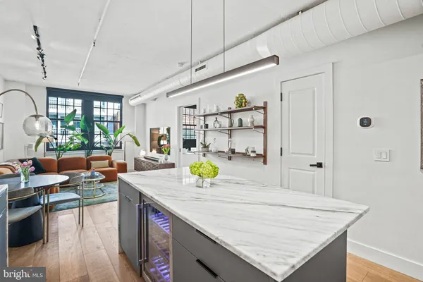 a view of kitchen island with granite countertop living room