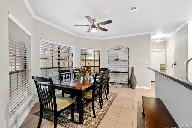 a dining room with furniture and window