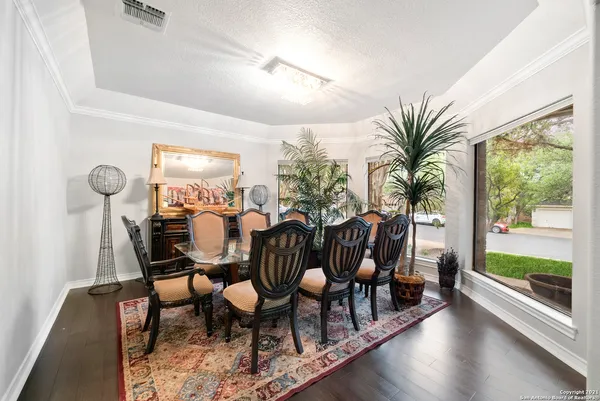 a view of a dining room with furniture window and wooden floor