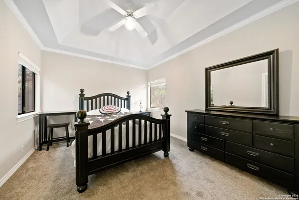 a bedroom with a bed and a dresser