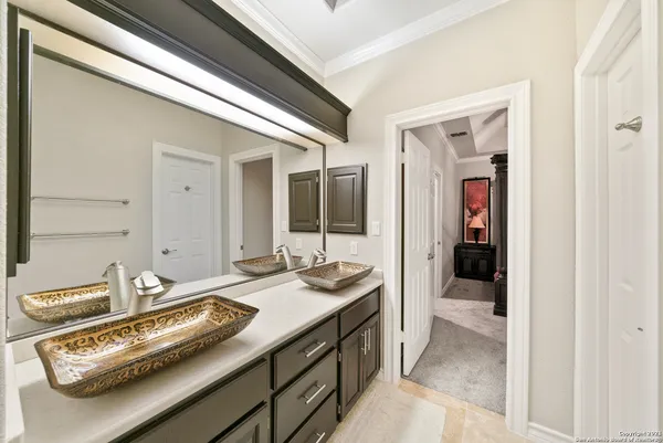 a bathroom with a sink and mirror