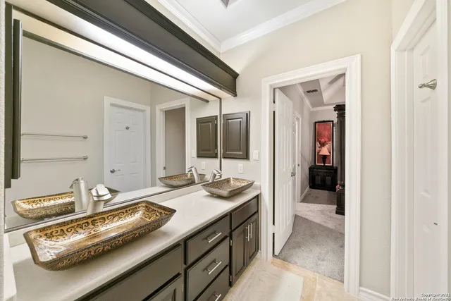 a bathroom with a sink and mirror