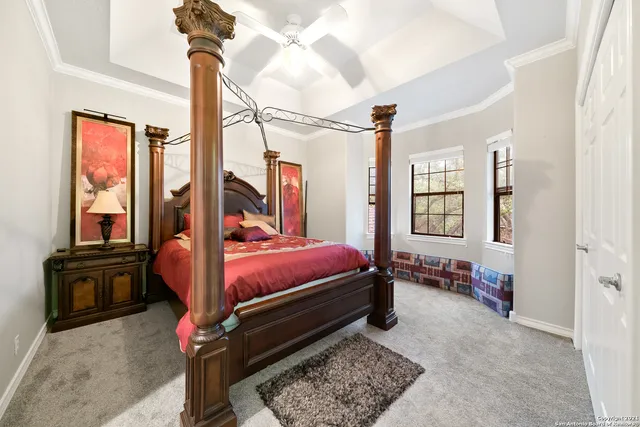 a bed room with a bed and windows