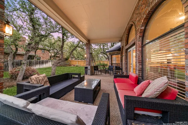 a view of swimming pool with outdoor seating