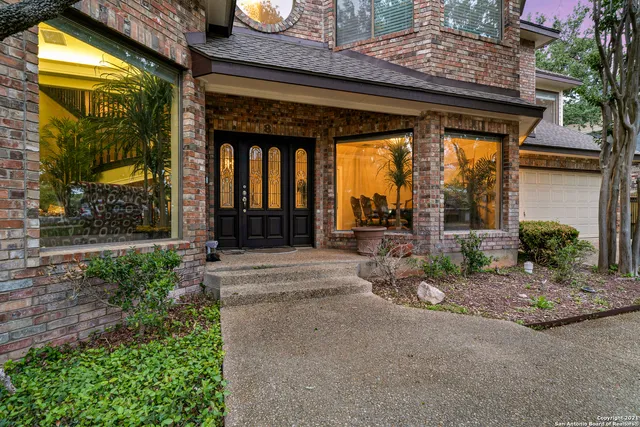 a view of a brick house with a large windows