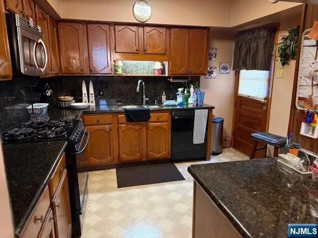 a view of a dining room with furniture and a chandelier
