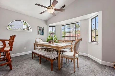 a view of a dining room with furniture