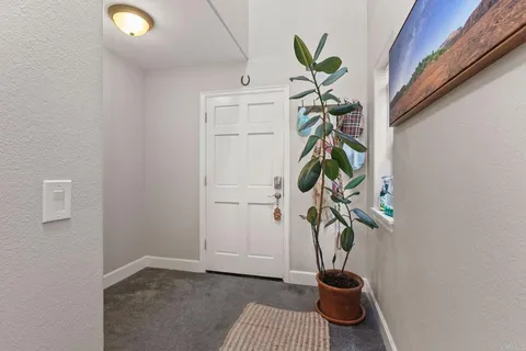 a glass vase with flowers on a table