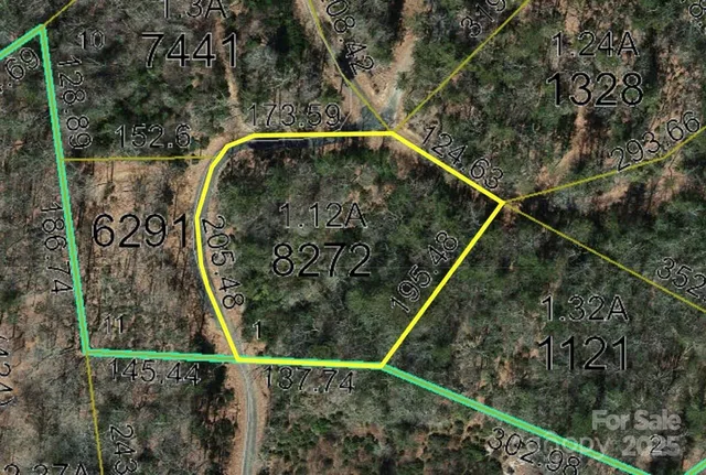 a view of a green field with lots of bushes