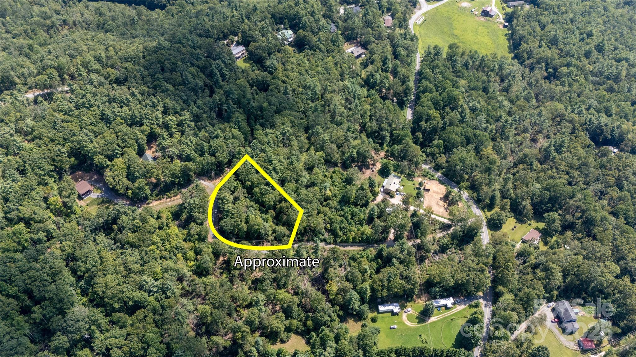 0 Humpback Mountain Road Spruce Pine, NC 28777 - Photo 22 of 25 an aerial view of a house with a yard and lake view