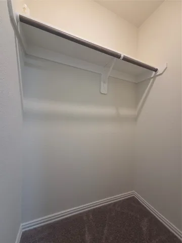 a view of a livingroom with furniture and chandelier