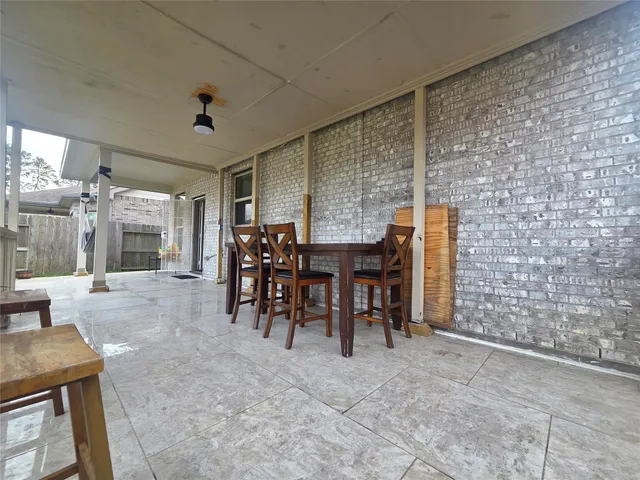a view of a house with a yard and sitting area