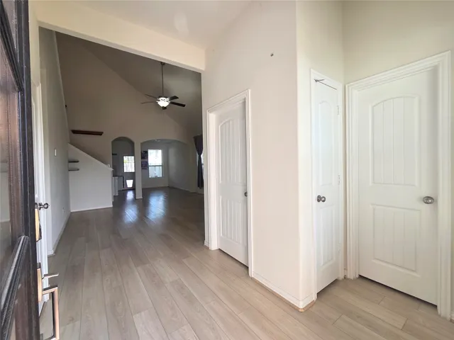 a view of gallery with wooden floor