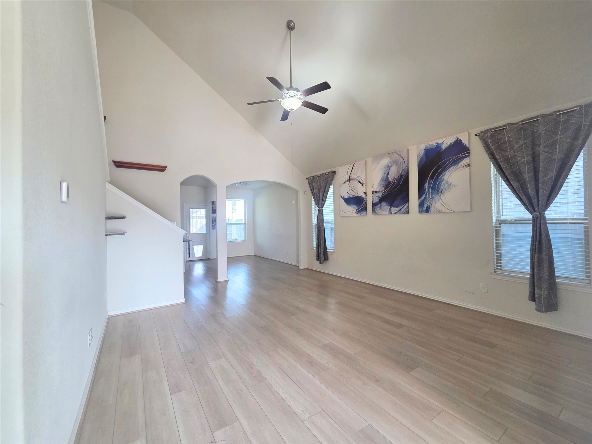 28137 Aspen Horizon Drive Spring, TX 77386 - Photo 4 of 33 a view of a livingroom with wooden floor and a ceiling fan