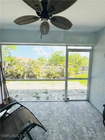 a view of a floor to ceiling window and an ocean view