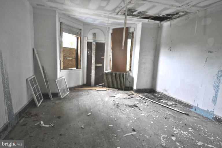 2906 Riggs Avenue Baltimore, MD 21216 - Photo 4 of 6 a view of empty room with floor to ceiling window