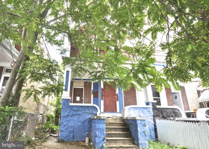 2906 Riggs Avenue Baltimore, MD 21216 - Photo 5 of 6 a view of house with a tree in front of it