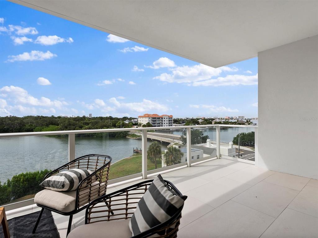1020 Sunset Point Road, Unit 410 Clearwater, FL 33755 - Photo 13 of 27 a view of a chairs and table in a terrace