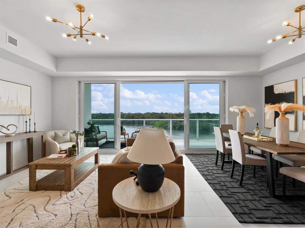 1020 Sunset Point Road, Unit 410 Clearwater, FL 33755 - Photo 15 of 27 a living room with furniture and a large window