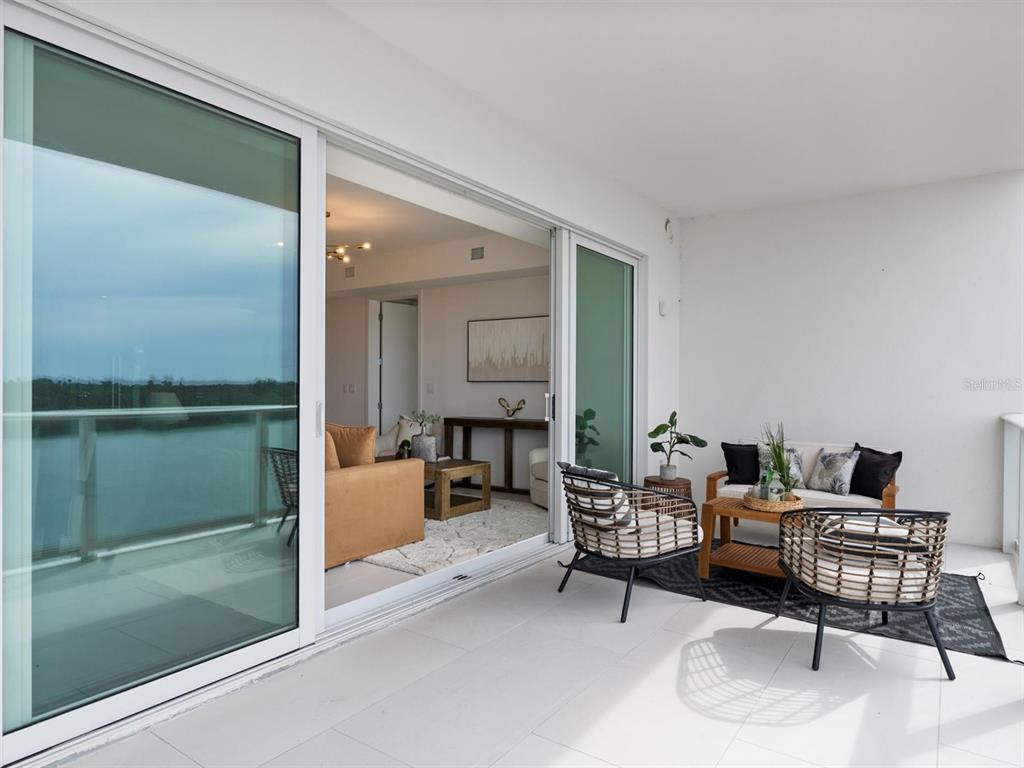 1020 Sunset Point Road, Unit 410 Clearwater, FL 33755 - Photo 10 of 27 a living room with furniture and a table