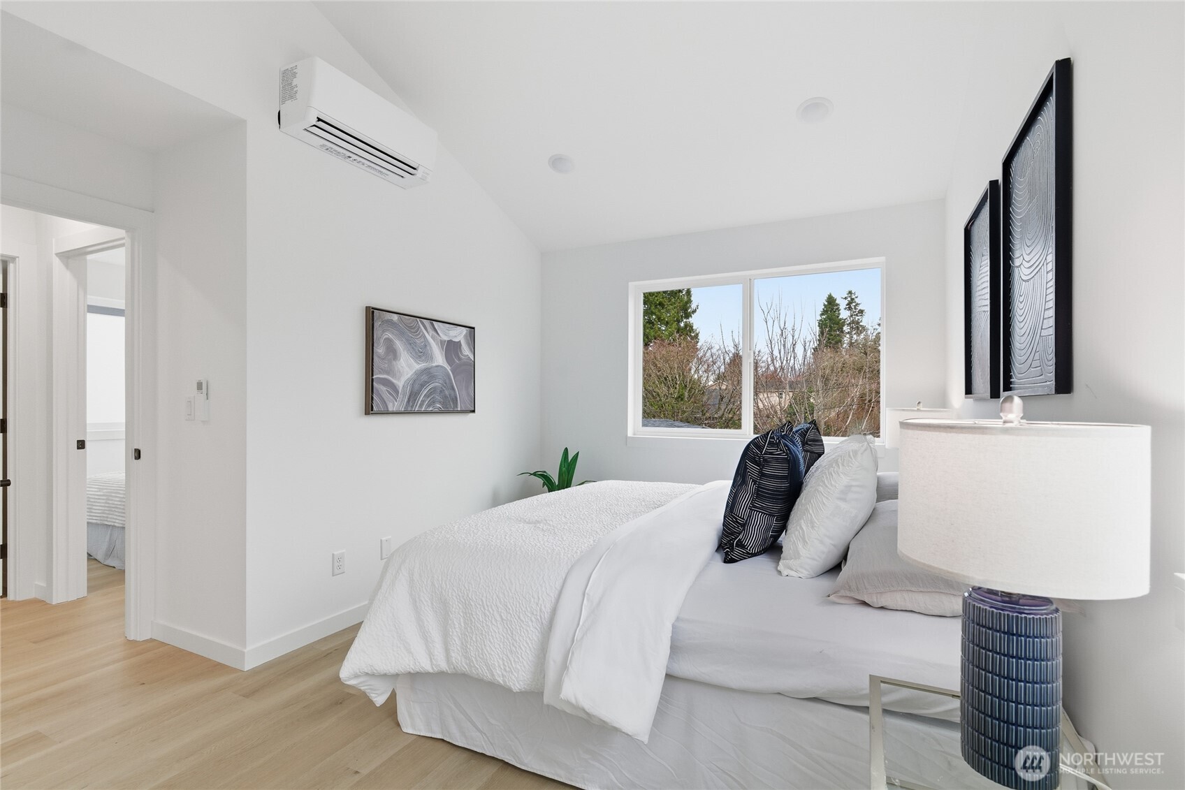 805 South Sullivan Street Seattle, WA 98108 - Photo 11 of 20 a bedroom with a bed and a lamp on dresser