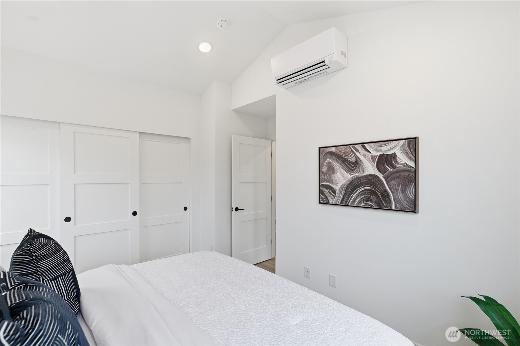 805 South Sullivan Street Seattle, WA 98108 - Photo 12 of 20 a bedroom with a bed and a painting on the wall