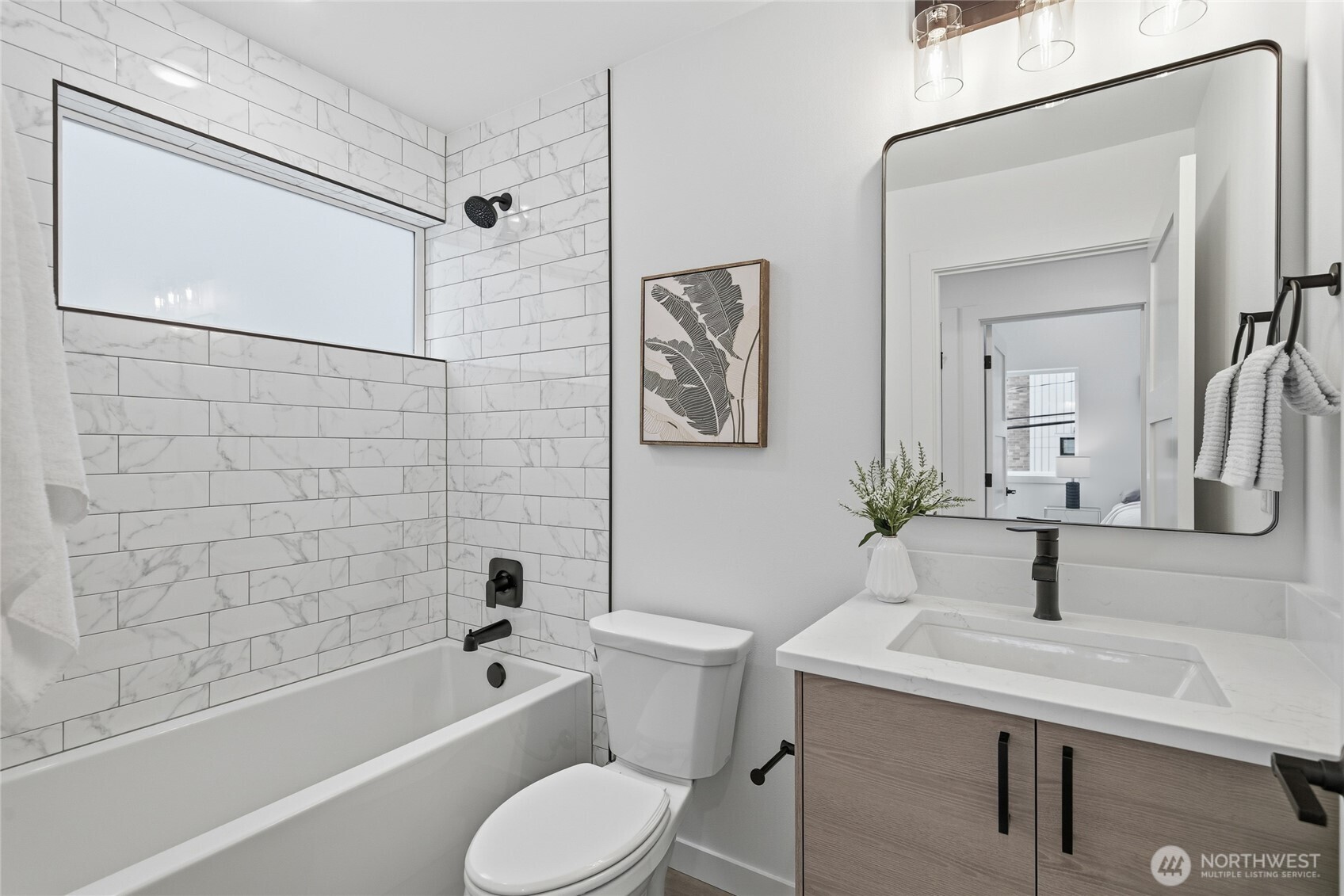 805 South Sullivan Street Seattle, WA 98108 - Photo 14 of 20 a bathroom with a sink toilet and shower