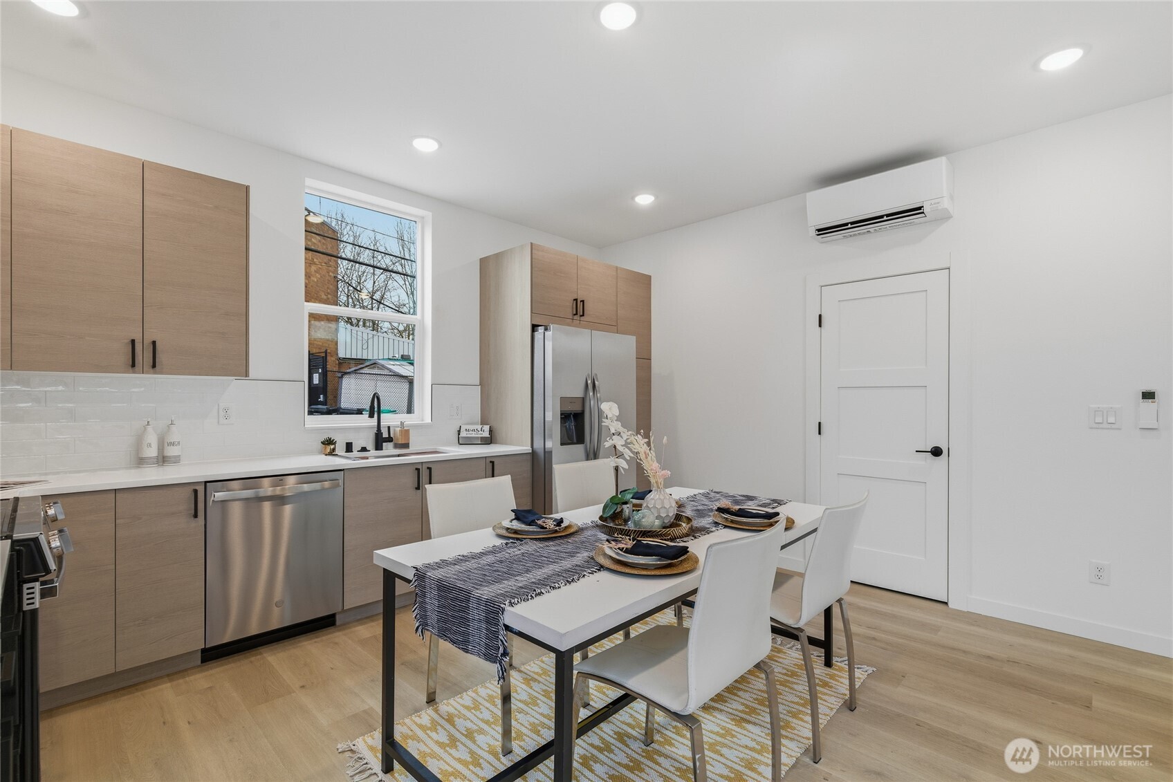 805 South Sullivan Street Seattle, WA 98108 - Photo 7 of 20 a kitchen with granite countertop a sink cabinets and wooden floor
