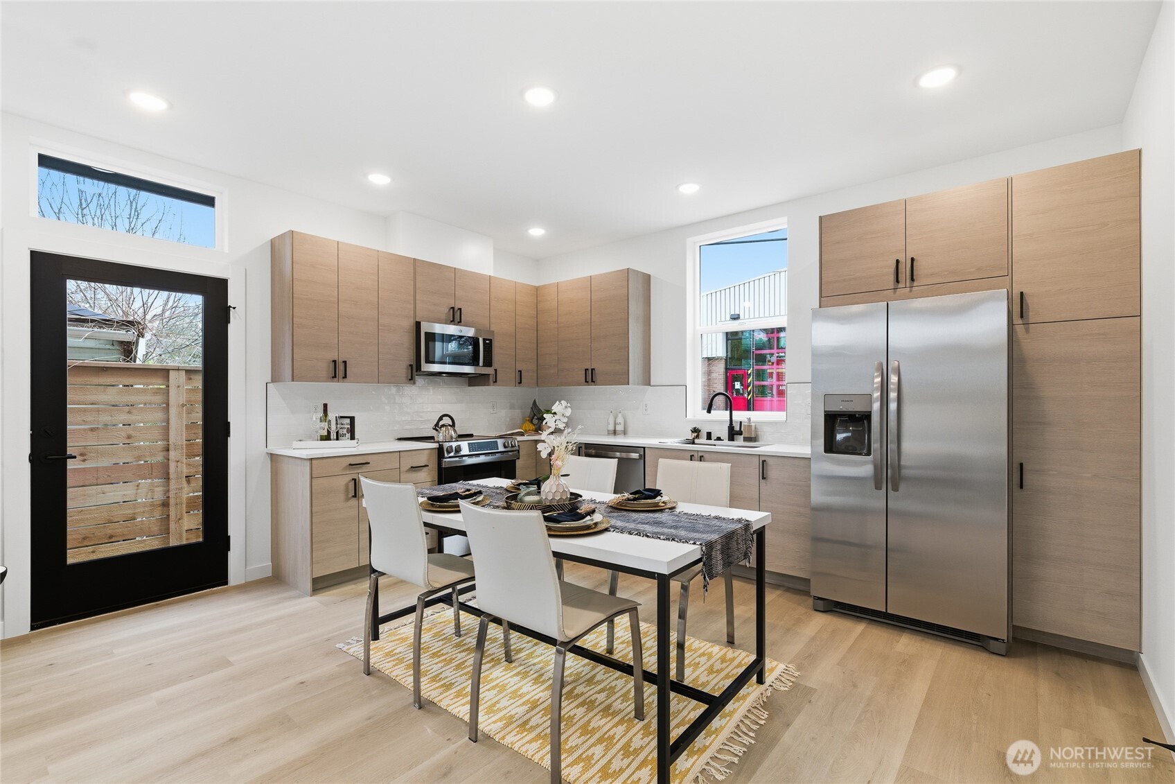 805 South Sullivan Street Seattle, WA 98108 - Photo 8 of 20 a kitchen with stainless steel appliances granite countertop a refrigerator and a stove top oven