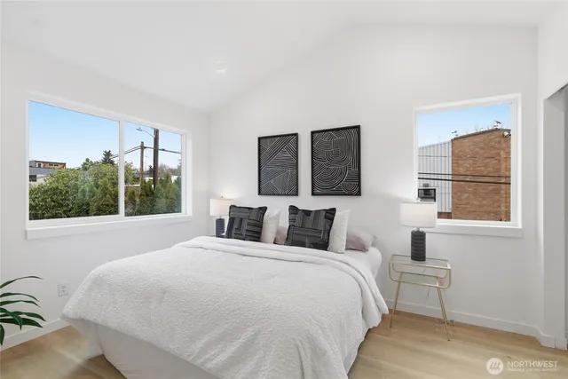 a bedroom with a large bed and a window