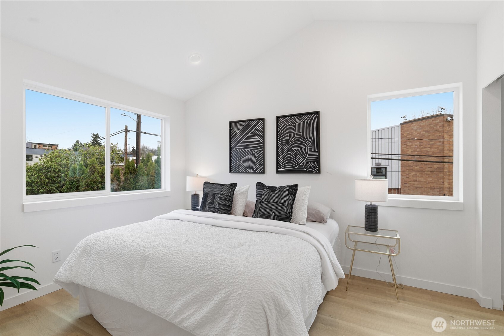 805 South Sullivan Street Seattle, WA 98108 - Photo 10 of 20 a bedroom with a large bed and a window