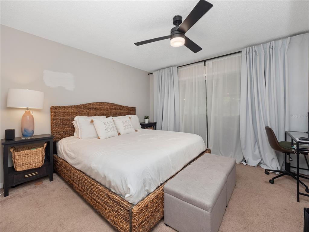 2733 Middle Street Orlando, FL 32807 - Photo 17 of 23 a bedroom with a bed and a chandelier