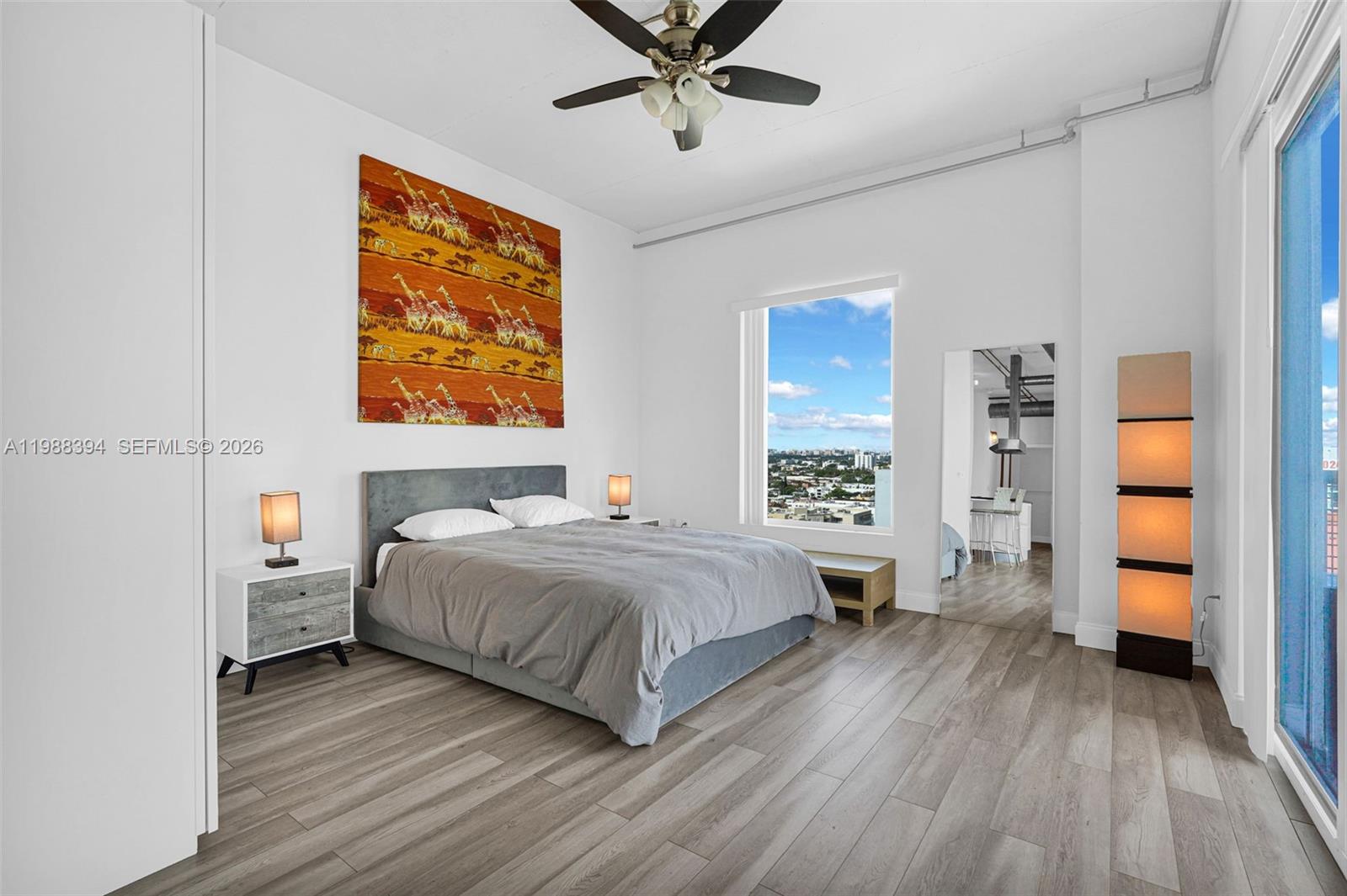 10 Southwest South River Drive, Unit 1615 Miami, FL 33130 - Photo 17 of 28 a bedroom with a large bed and a window