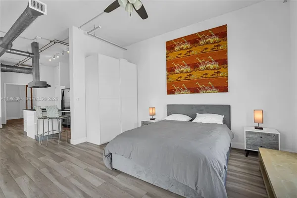 a bedroom with a bed and a table