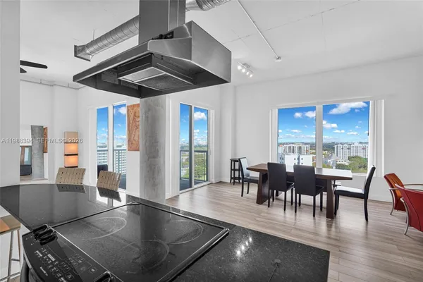 a view of a dining room with furniture window and outside view