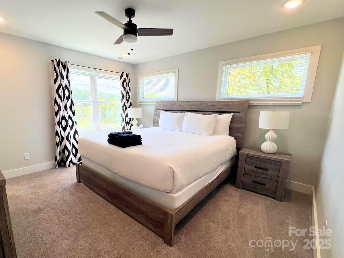 1057 Riverside Drive Asheville, NC 28804 - Photo 20 of 42 a bedroom with a bed and window