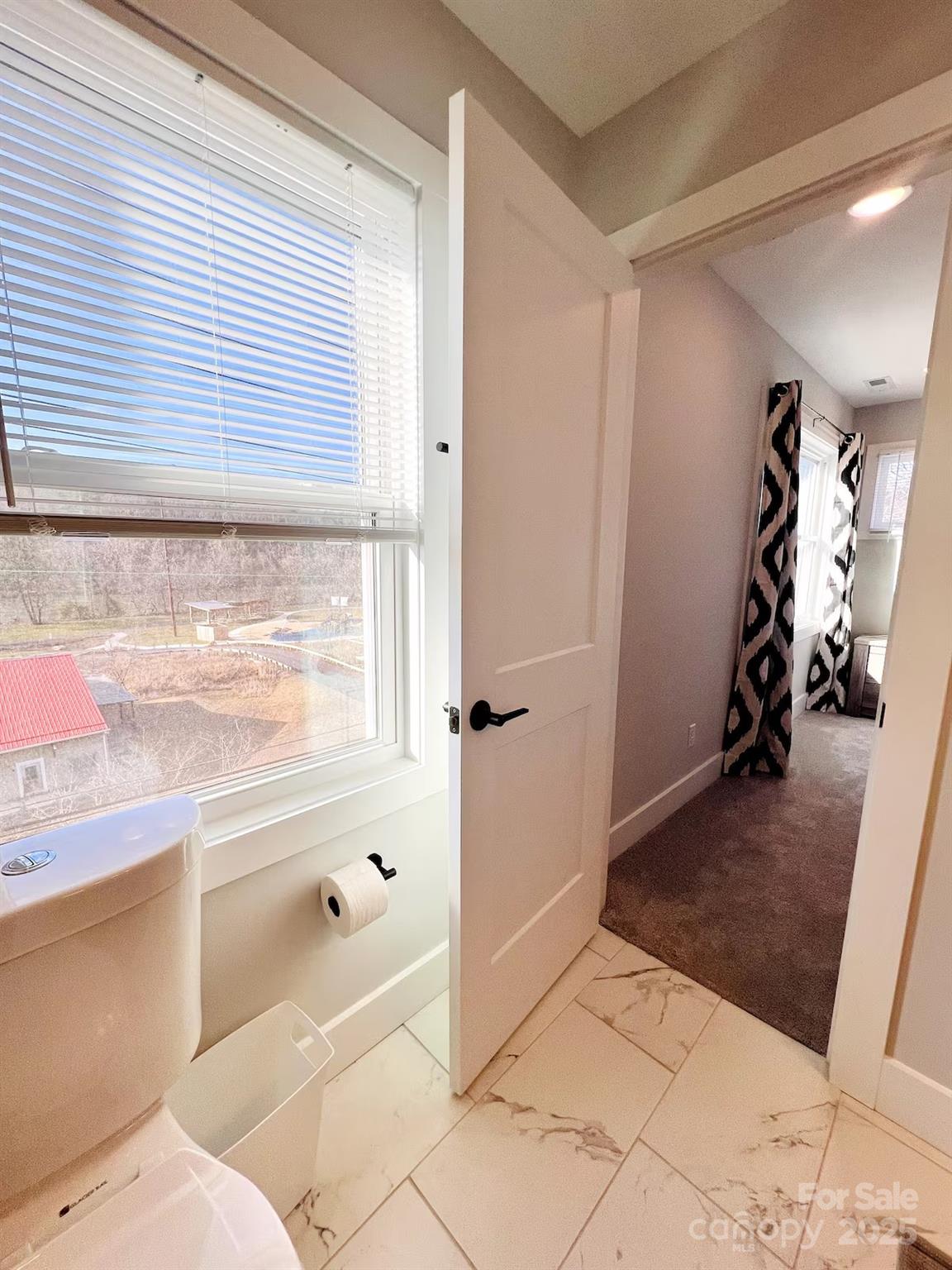 1057 Riverside Drive Asheville, NC 28804 - Photo 27 of 42 a bathroom with a sink and a shower