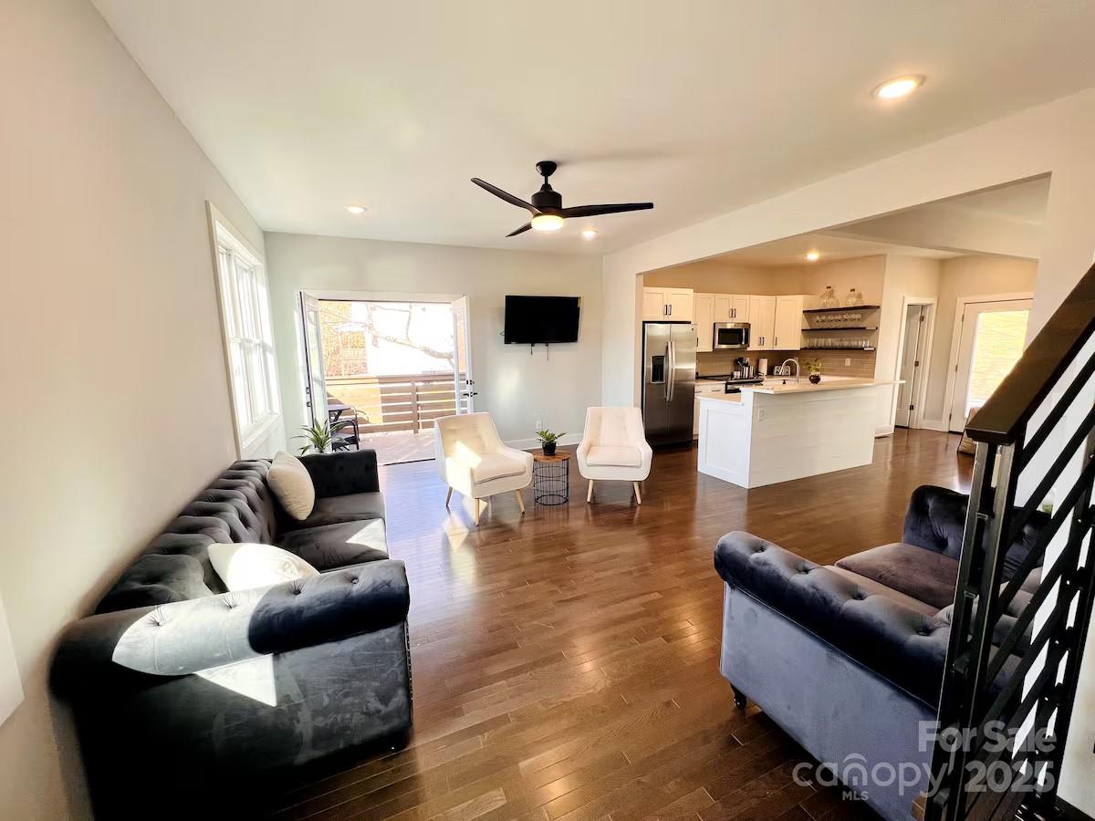 1057 Riverside Drive Asheville, NC 28804 - Photo 6 of 42 a living room with furniture and a wooden floor