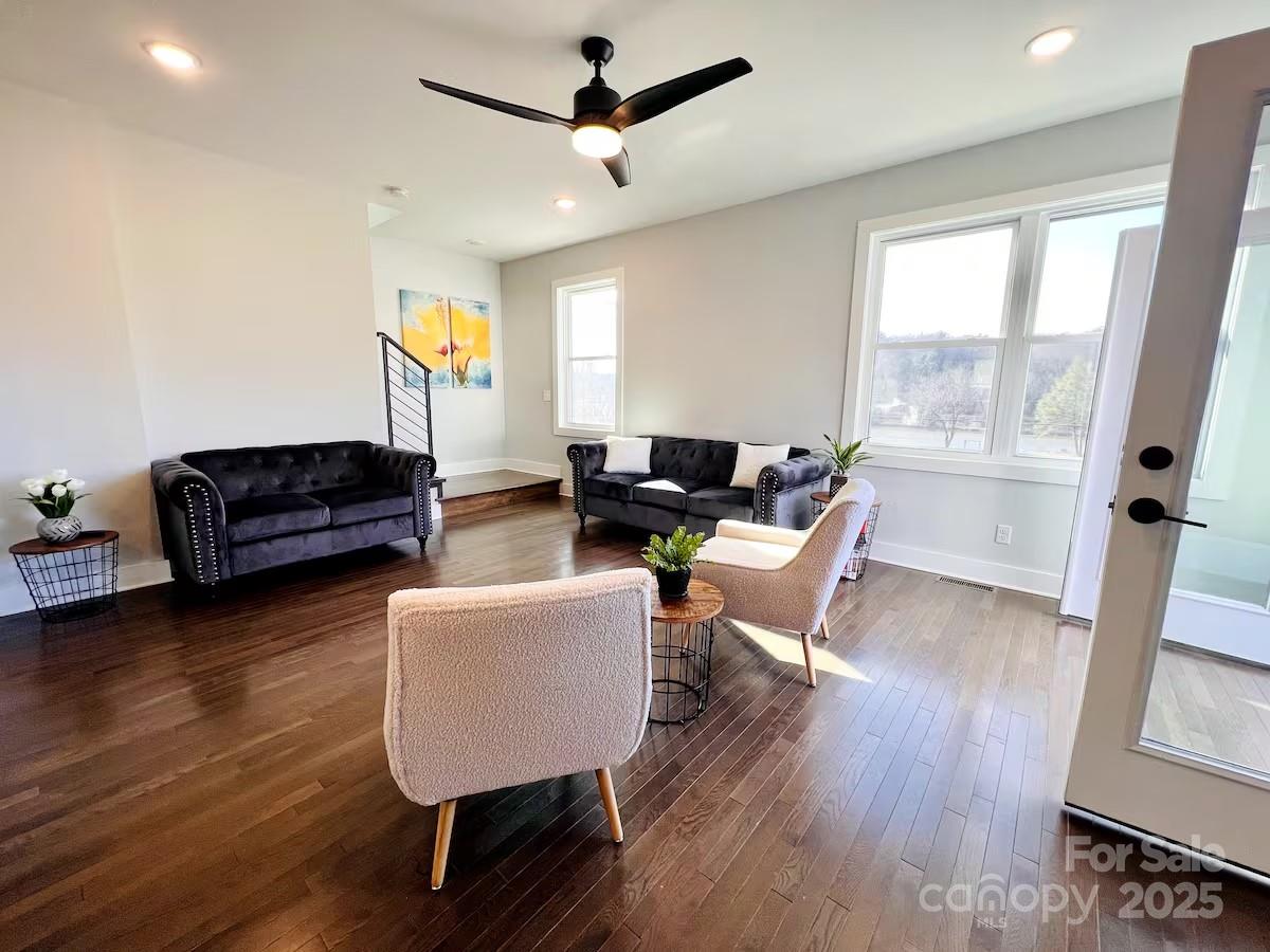 1057 Riverside Drive Asheville, NC 28804 - Photo 9 of 42 a living room with furniture and a wooden floor