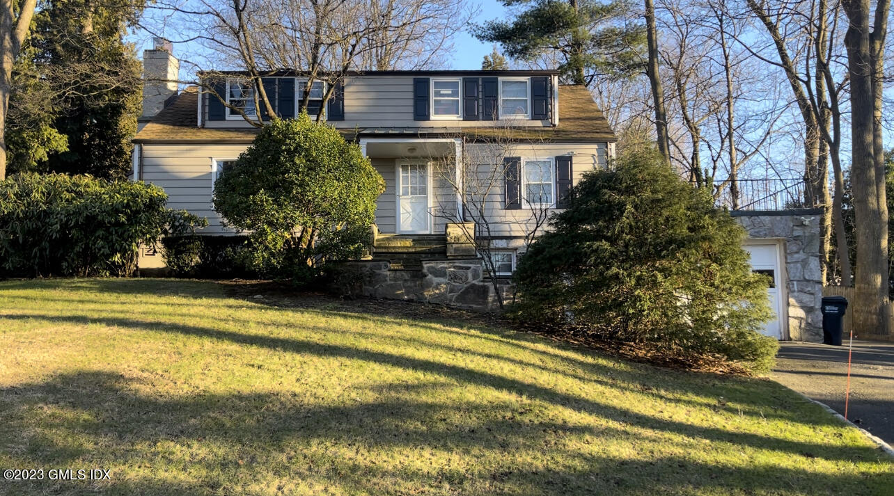 15 Somerset Lane Riverside, CT 06878 - Photo 1 of 1 a front view of house with small swimming pool