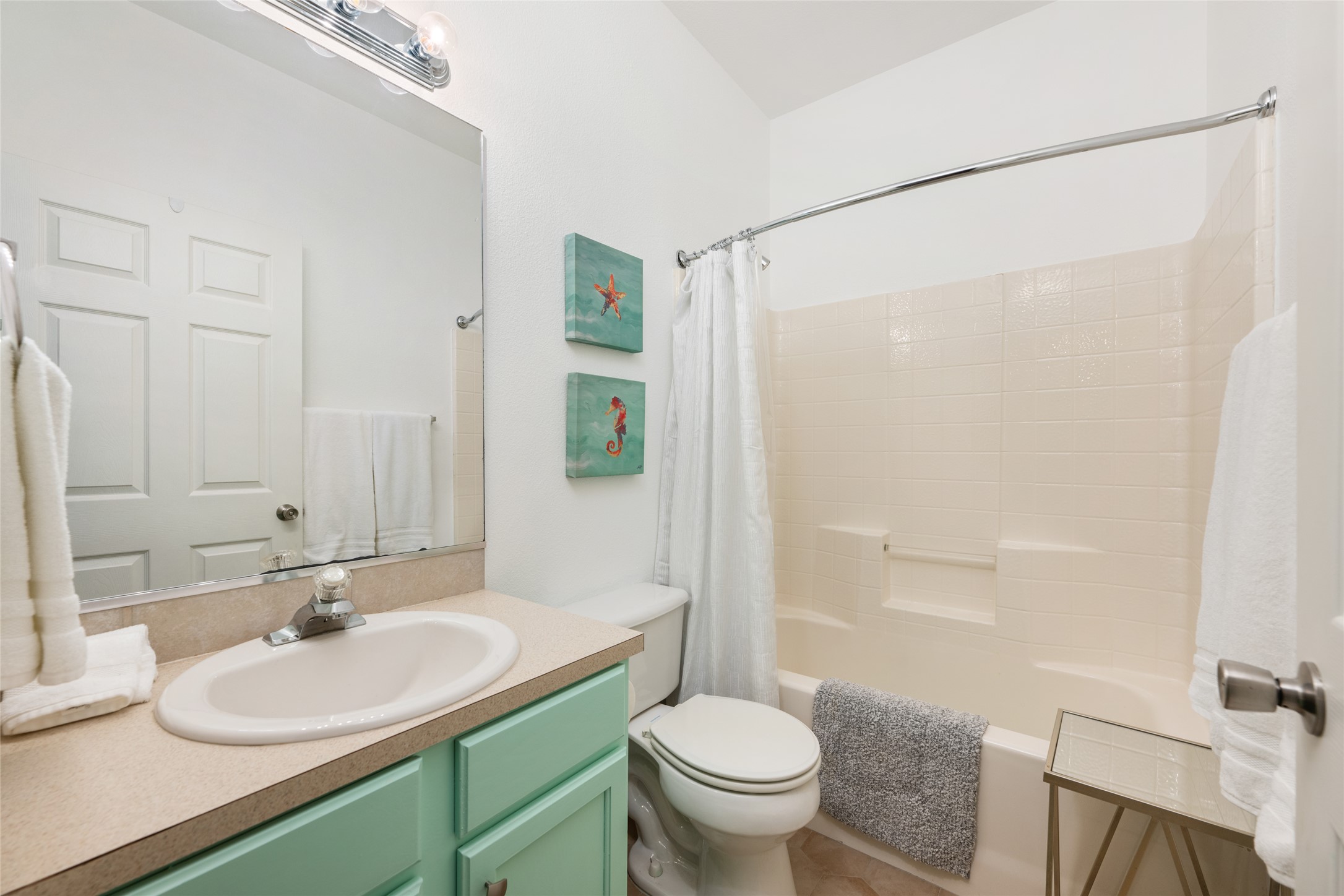 5613 Signal Point Austin, TX 78724 - Photo 9 of 21 Bathroom with light-toned vanity countertop, undermount sink, and a mirrored medicine cabinet