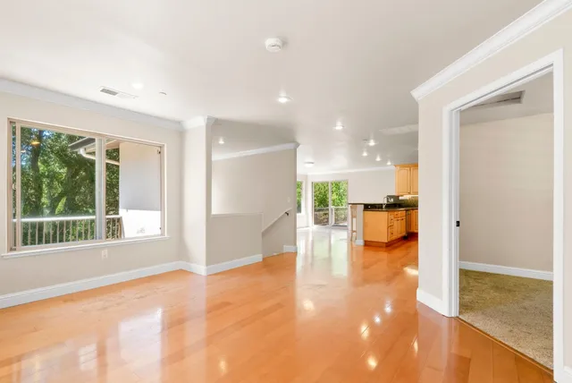 a view of kitchen with furniture and floor to ceiling window