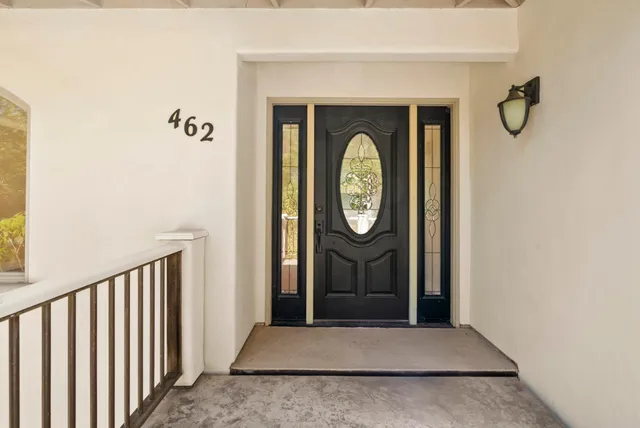 a view of a hallway with wooden door