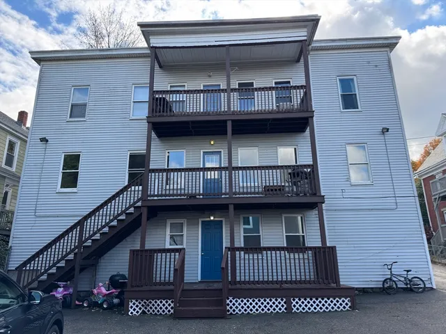 a view of house with entryway and stairs