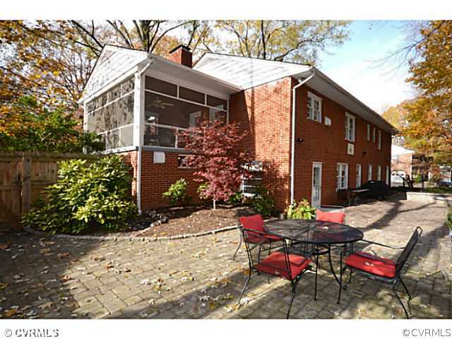 4411 Knob Road Richmond, VA 23235 - Photo 12 of 18 a view of a patio with a table and chairs and potted plants