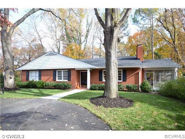 4411 Knob Road Richmond, VA 23235 - Photo 16 of 18 a front view of a house with a garden